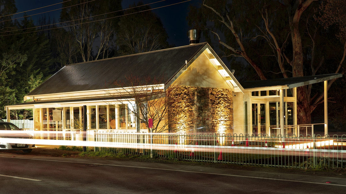 Stone facade of the Stanley Bridge Tavern at Verdun, lit at night
